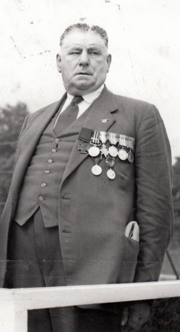 William McNally wearing his VC and other medals in September 1960